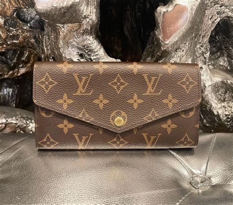 louis vuitton sarah wallet button replacement|Louis Vuitton monogram canvas wallet.